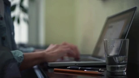Business man typing message using laptop at home Stock Footage 82925813