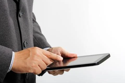 Business man using a android tablet pc like ipad, Mobile phone Stock Photos