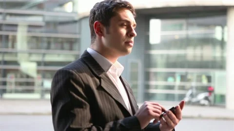 Business man using app on smartphone Stock Footage 11196833