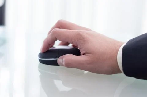 Business man using a black mouse Stock Photos