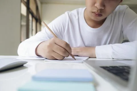 Business man Using calculator analyzing investment chart on the desk working at Stock Illustration