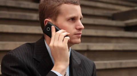 Business Man Using Cell On Front Steps Vidéo 22769831