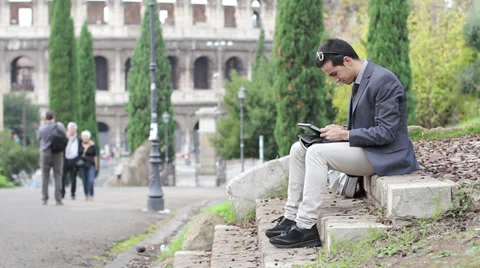 Business man using digital tablet at park Stock Footage 32578888