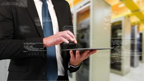 Business man using a digital tablet Stock Footage 107700450