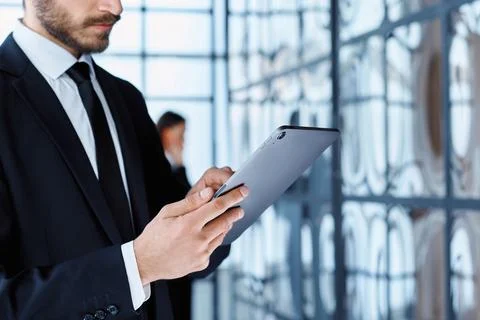 Business man using a digital tablet in the office. Stock Photos