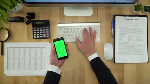 Business Man Using Green Screen Phone And Computer At Office Stock Footage 137098331