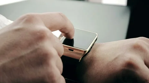Business man using his smartwatch app in the office Stock Footage 68509071
