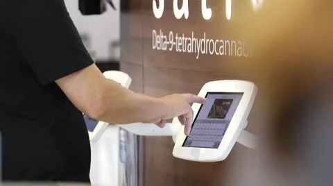 Business man using an iPad touchscreen at a tradeshow Stock Footage 56370793