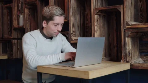 Business man using laptop at the cafe Stock Footage 75650404