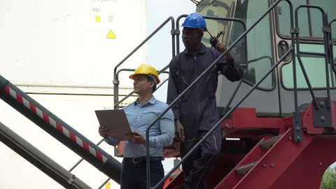 Business man using laptop  checking list inventory loading Containers box dis Stock Footage 154684628