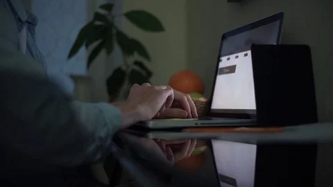 Business man using laptop working with analyzing graphs at home in evening. Stock Footage 82937184