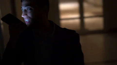 Business man using mobile alone in dark office Stock Footage 88560287