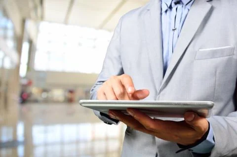 Business Man Using Mobile Digital Tablet in Modern Building. Stock Photos