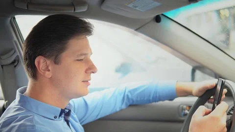 Business man using mobile phone in car. Stock Footage 81817932