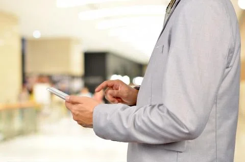Business Man Using Mobile Tablet in Modern Business Building. Stock Photos