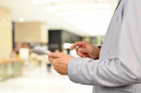 Business Man Using Mobile Tablet in Modern Business Building. Stock Photos