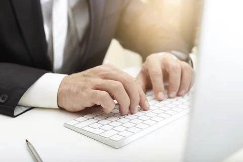 Business man using modern computer typing on keyboard business concept Stock Photos