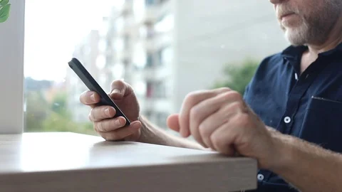 Business man using modern smartphone device sitting in cafe window success 스톡 동영상 110840670