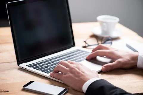 Business man using notebook in a coffe shop Stock Photos