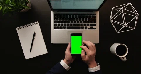 Business man using smart phone, checking information on cell phone with green Stock Footage 74976868
