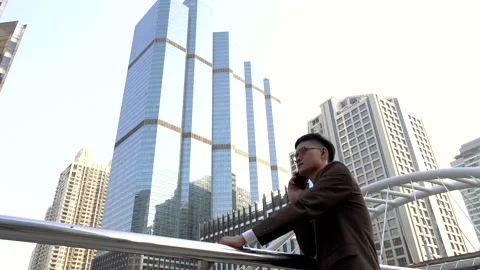 Business man using smart phone in modern city 스톡 동영상 132635698