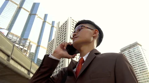 Business man using smart phone in modern city Stock Footage 132636467