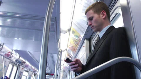 Business Man Using Smartphone on Clean Subway - Close Profile Shot Vídeos de archivo 22759887