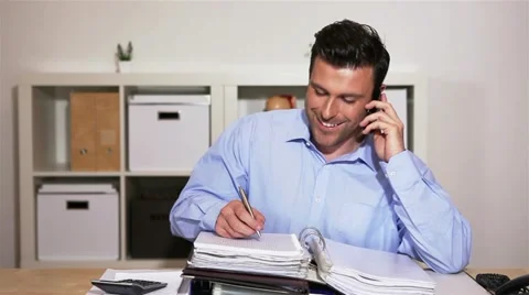 Business man using smartphone in office Stock Footage 11019494