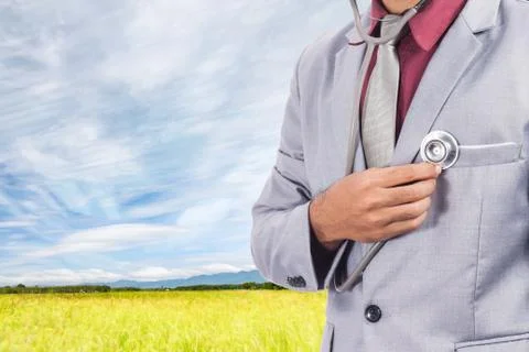 Business man using stethoscope checking his heart Stock Photos