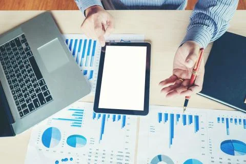 Business man Using tablet blank screen with  Report chart Stock Photos