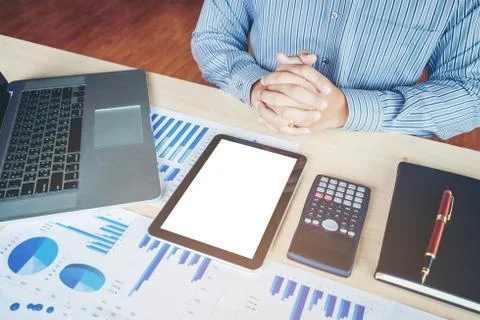 Business man Using tablet blank screen with; Report chart Stock Photos