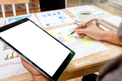 Business man Using tablet blank screen with Report chart Stock Photos