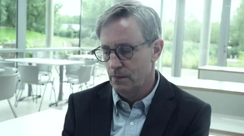 Business man using a tablet in office cafeteria Stock Footage 59401072