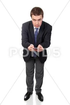 Business man wearing dark suit, isolated over white background Stock Photos
