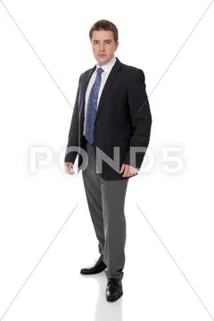 Business man wearing dark suit, isolated over white background Stock Photos