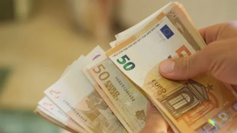 Business man while count euro bills banknotes,investment income earnings,money Stock Footage 167186635