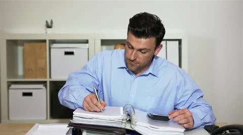 Business man working with calculator Stock Footage 11019456