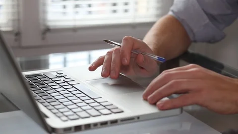 Business man working with computer in office interior, close up of hands Stock Footage 98100563