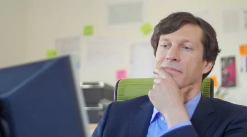 Business man working by the computer satisfied close up Stock Footage 49723390