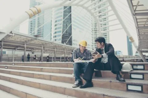 Business man is working with engineer Stock Photos