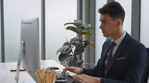 Business man working in front of computer typing on keyboard. Stock Footage 161322990