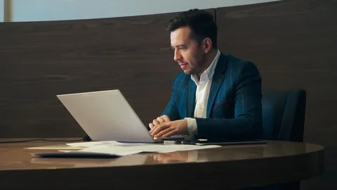 Business man working on laptop computer in luxury office Stock Footage 96419487