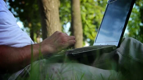 Business man working on a notebook in the park. Stock Footage 40310434