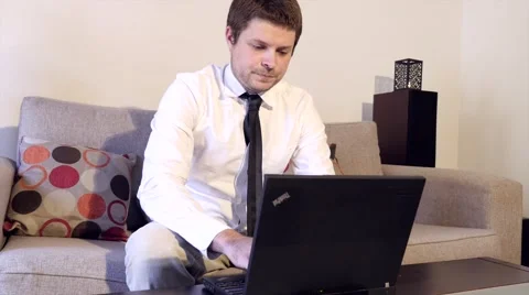 Business Man Working on Sofa 库存影片 40272904