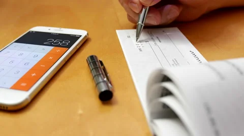 Business man writing a cheque Stock Footage 57844996