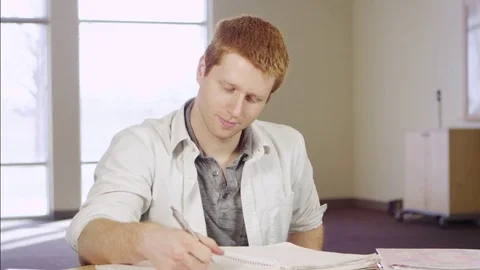 Business man writing with his left hand Stock Footage 80227329