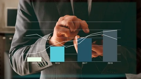 Business Manager interacts with heads-up display that shows animated graphics Stock Footage 101974415