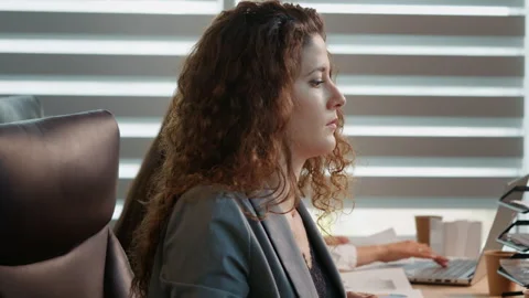 Business manager lying on her back tired of working relaxing in office. Stock Footage 295811182