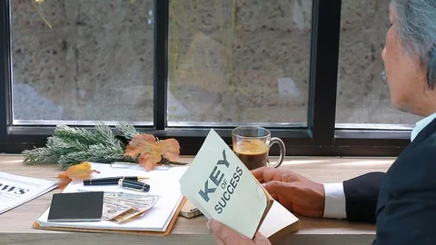 Business manager reading book and drinking coffee.  Stock Footage 101330275