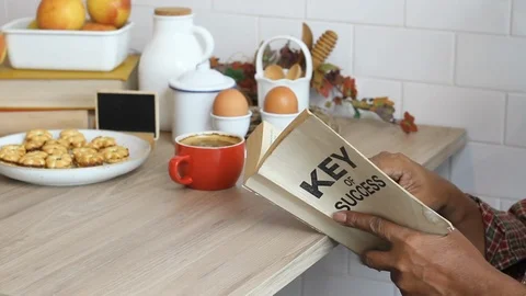 Business manager reading book and drinking coffee.  Stock Footage 101940218